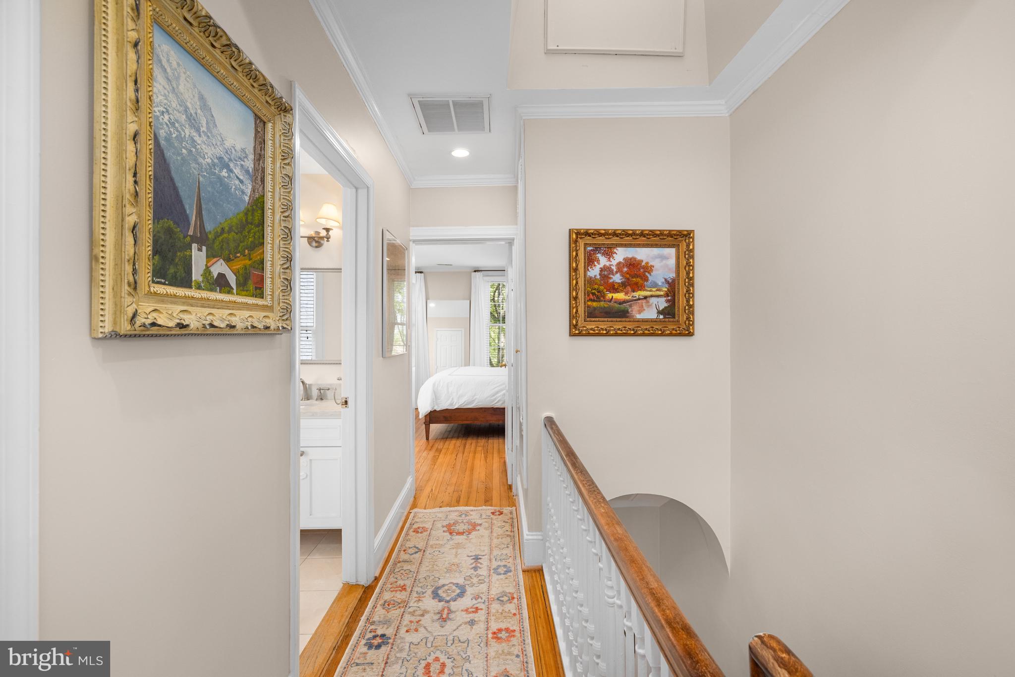 3104 N Street Northwest Washington, DC 20007 - Photo 12 of 25 a view of a hallway with paintings on the wall