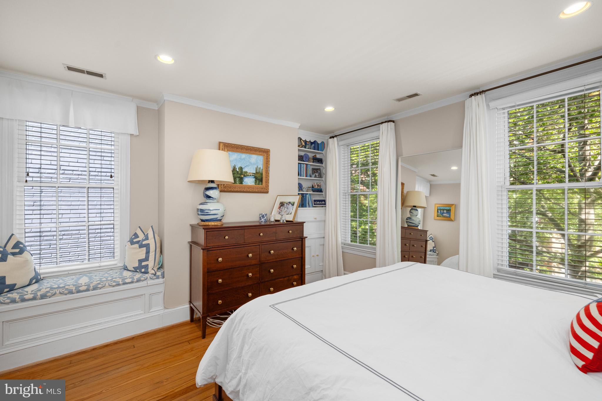 3104 N Street Northwest Washington, DC 20007 - Photo 14 of 25 a bedroom with a bed and a large window