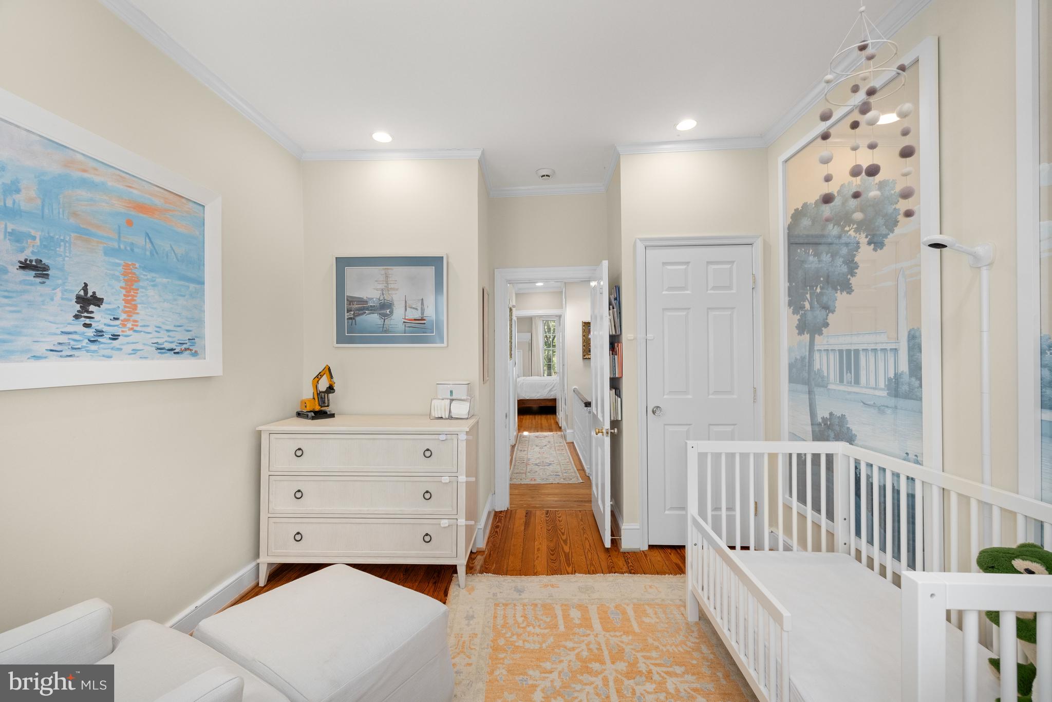 3104 N Street Northwest Washington, DC 20007 - Photo 16 of 25 a living room with furniture and a baby crib