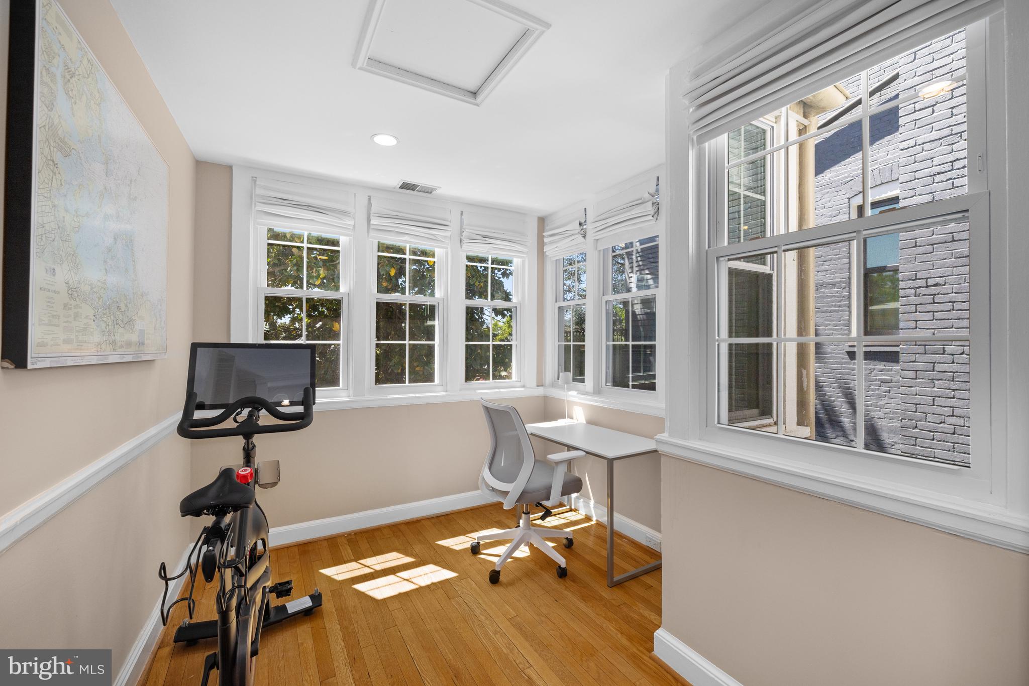 3104 N Street Northwest Washington, DC 20007 - Photo 18 of 25 a view of a workspace with furniture and a window