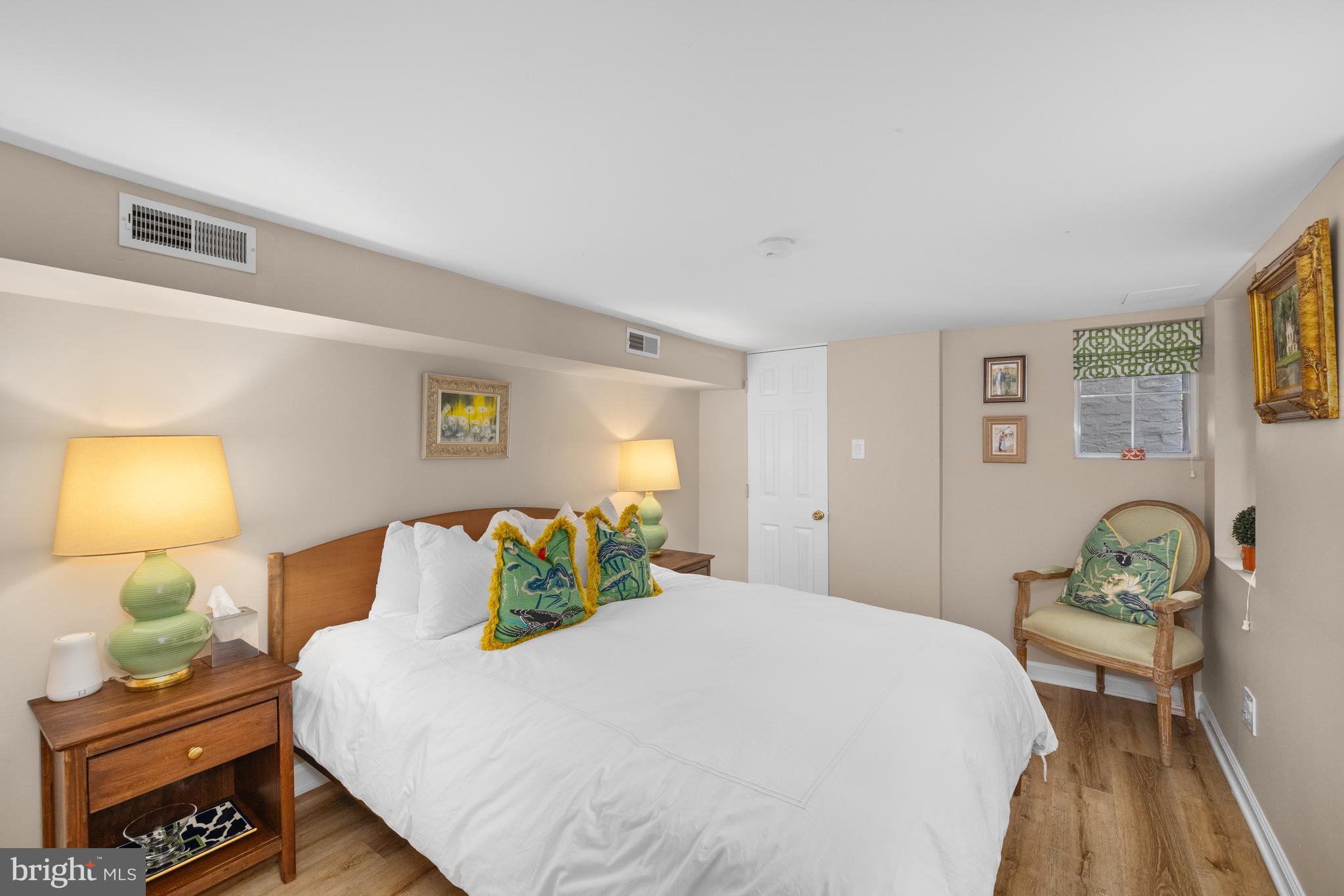 3104 N Street Northwest Washington, DC 20007 - Photo 22 of 25 a bedroom with a bed and wooden floor