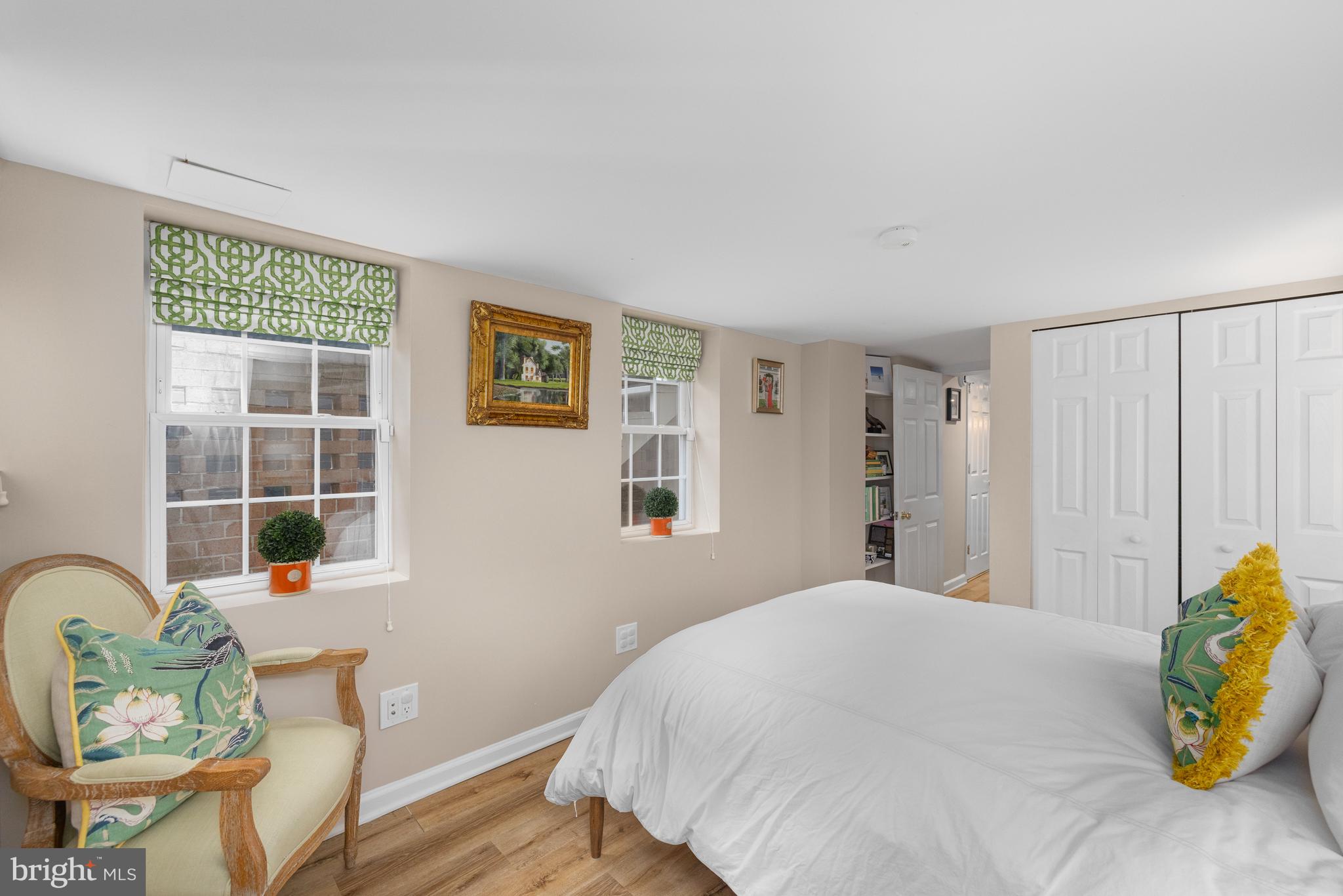 3104 N Street Northwest Washington, DC 20007 - Photo 23 of 25 a bedroom with a bed and wooden floor