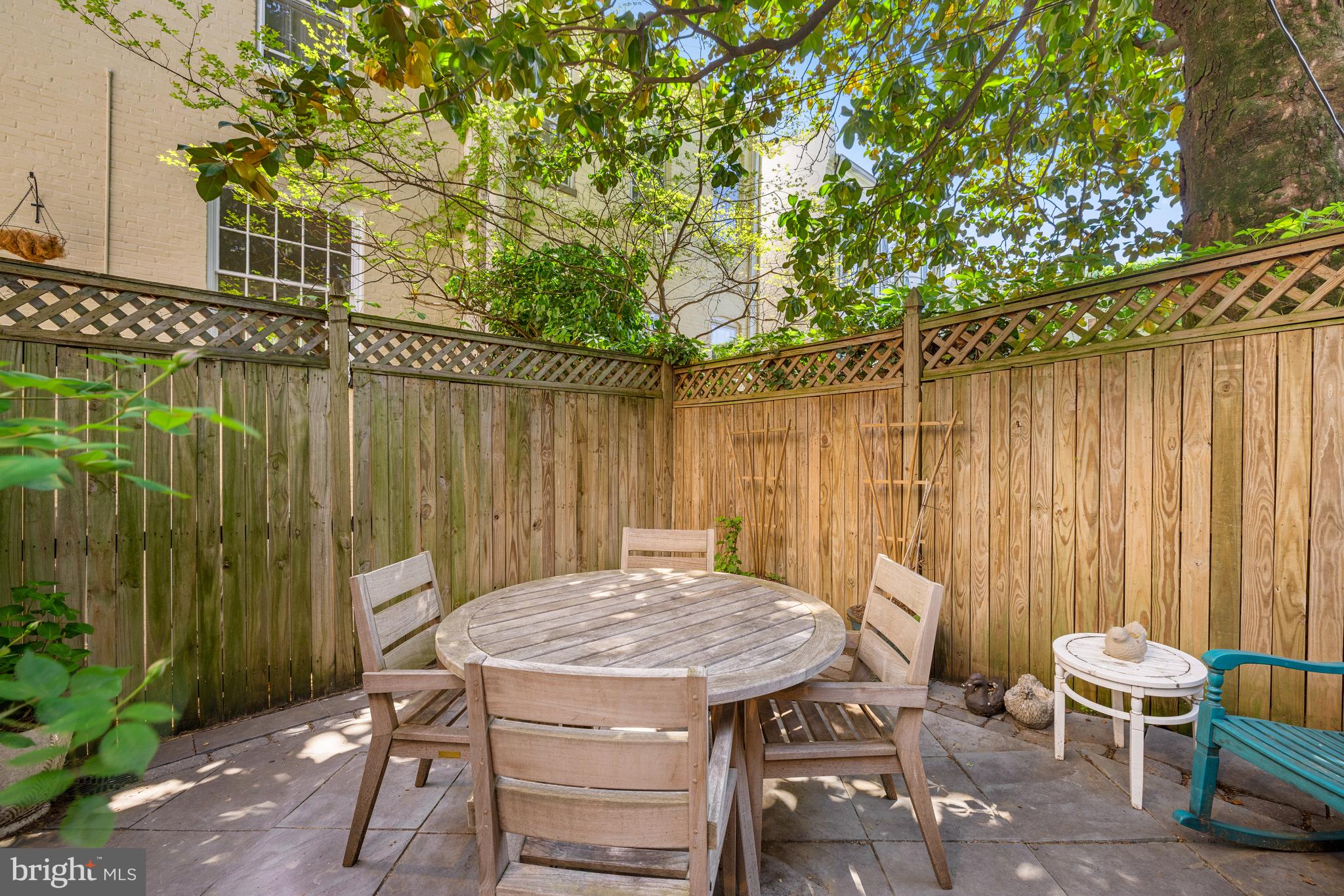 3104 N Street Northwest Washington, DC 20007 - Photo 24 of 25 a table and chairs in front of a house