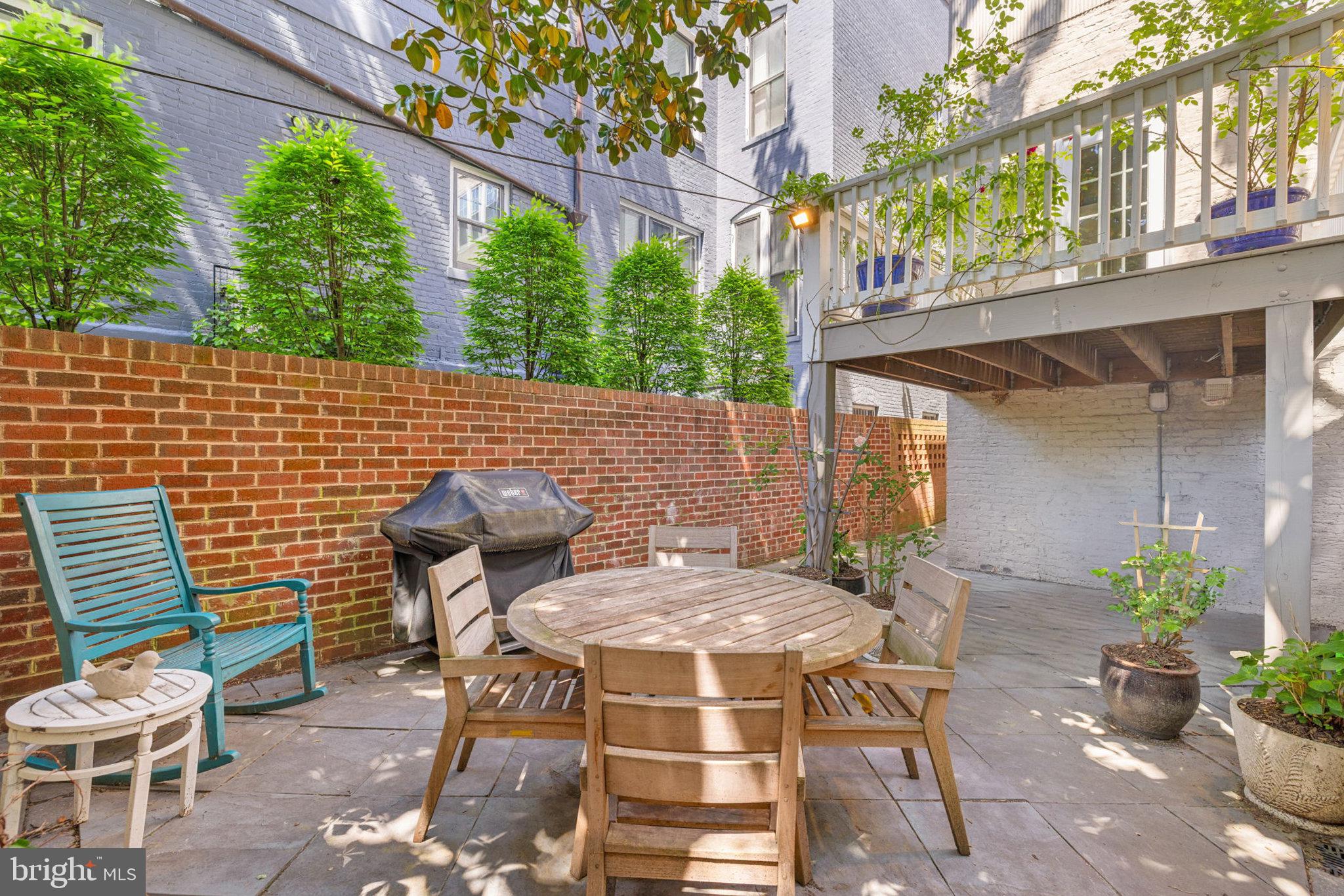 3104 N Street Northwest Washington, DC 20007 - Photo 25 of 25 a backyard of a house with table and chairs