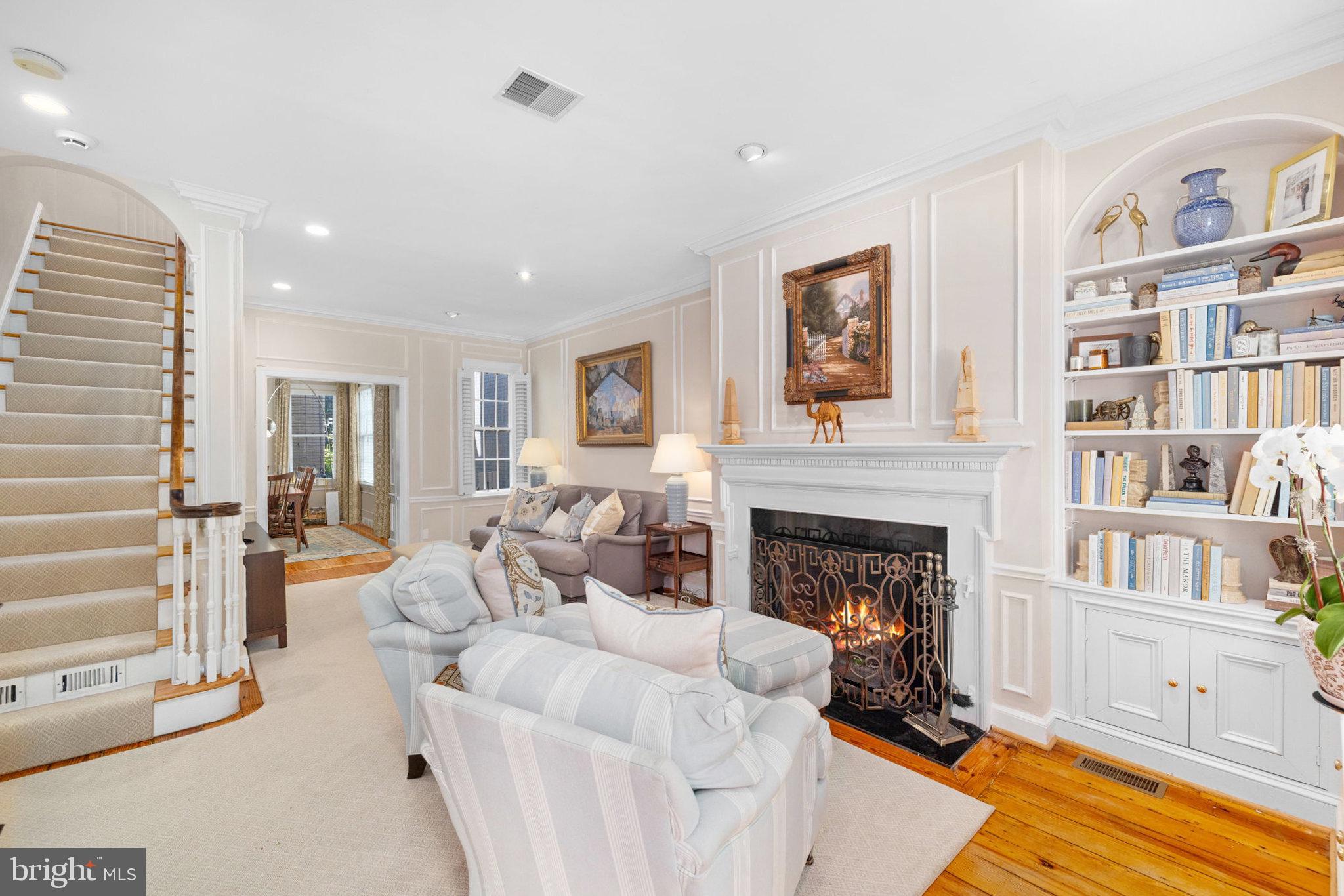 3104 N Street Northwest Washington, DC 20007 - Photo 3 of 25 a living room with furniture and a fireplace