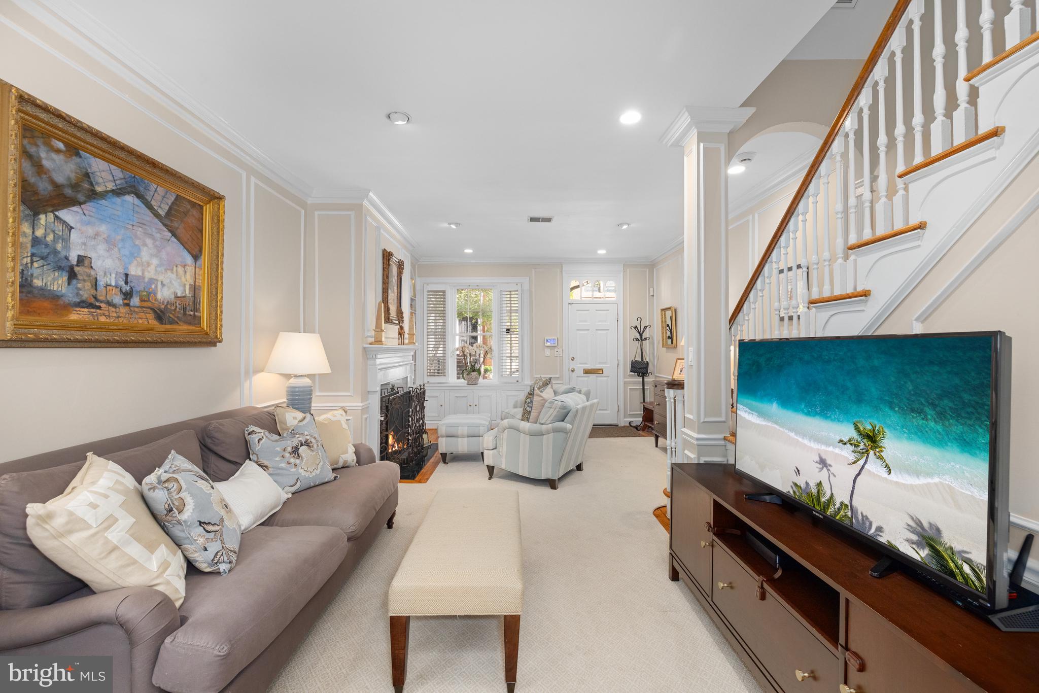 3104 N Street Northwest Washington, DC 20007 - Photo 4 of 25 a living room with furniture and a flat screen tv