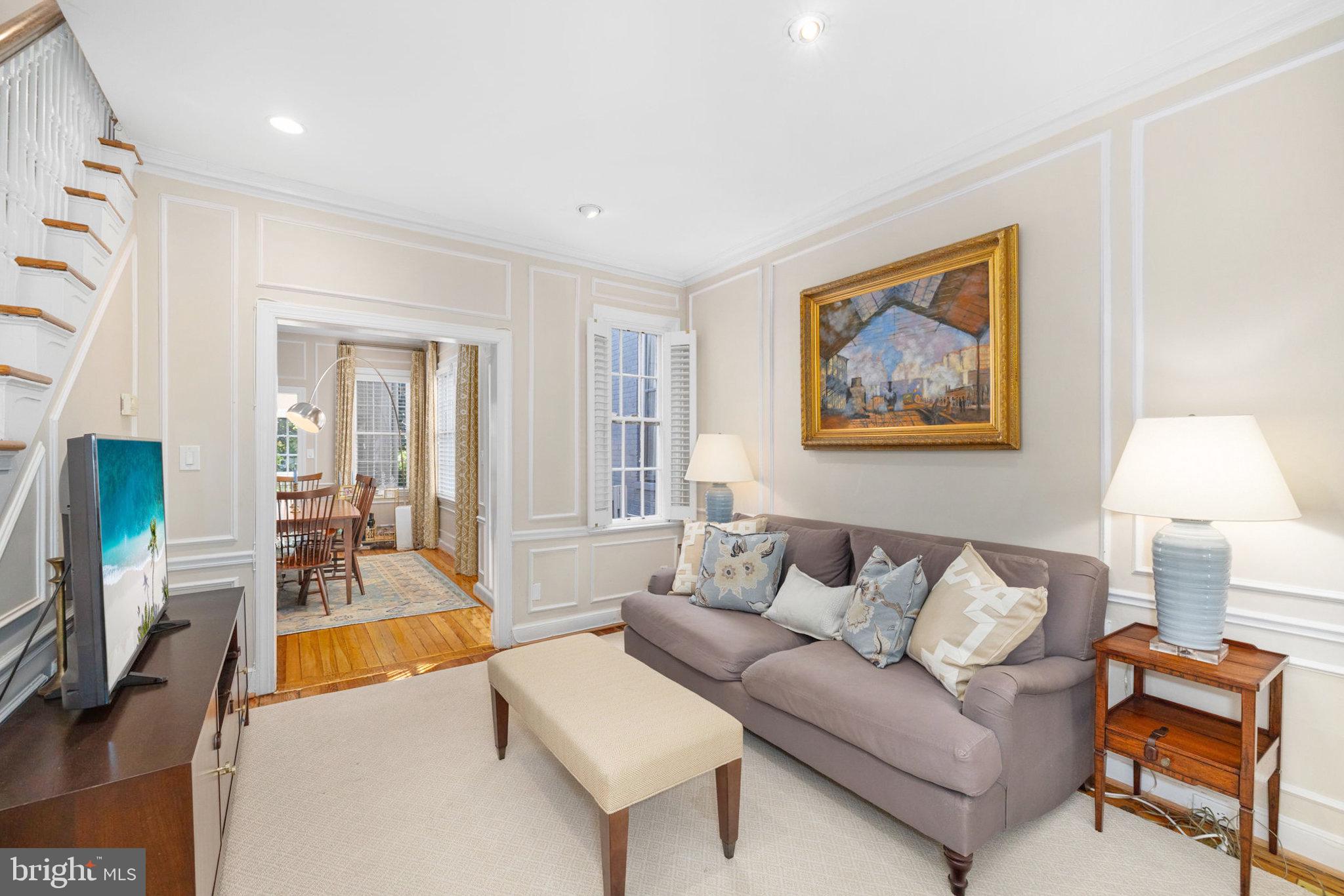 3104 N Street Northwest Washington, DC 20007 - Photo 5 of 25 a living room with furniture and a flat screen tv