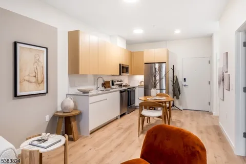 a work room with furniture and wooden floor