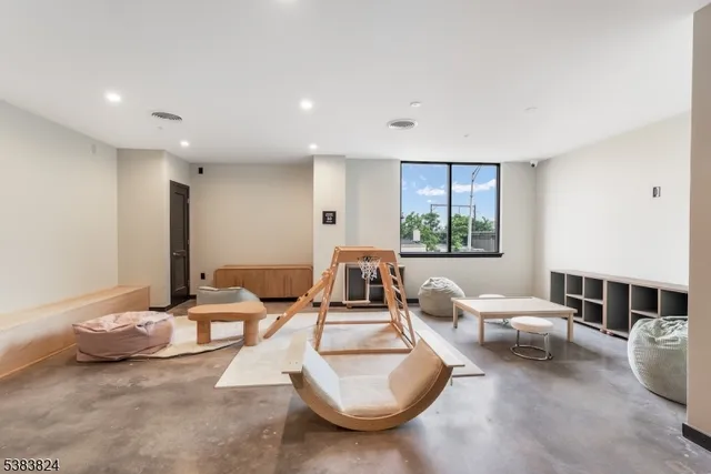 a living room with furniture window and a fireplace