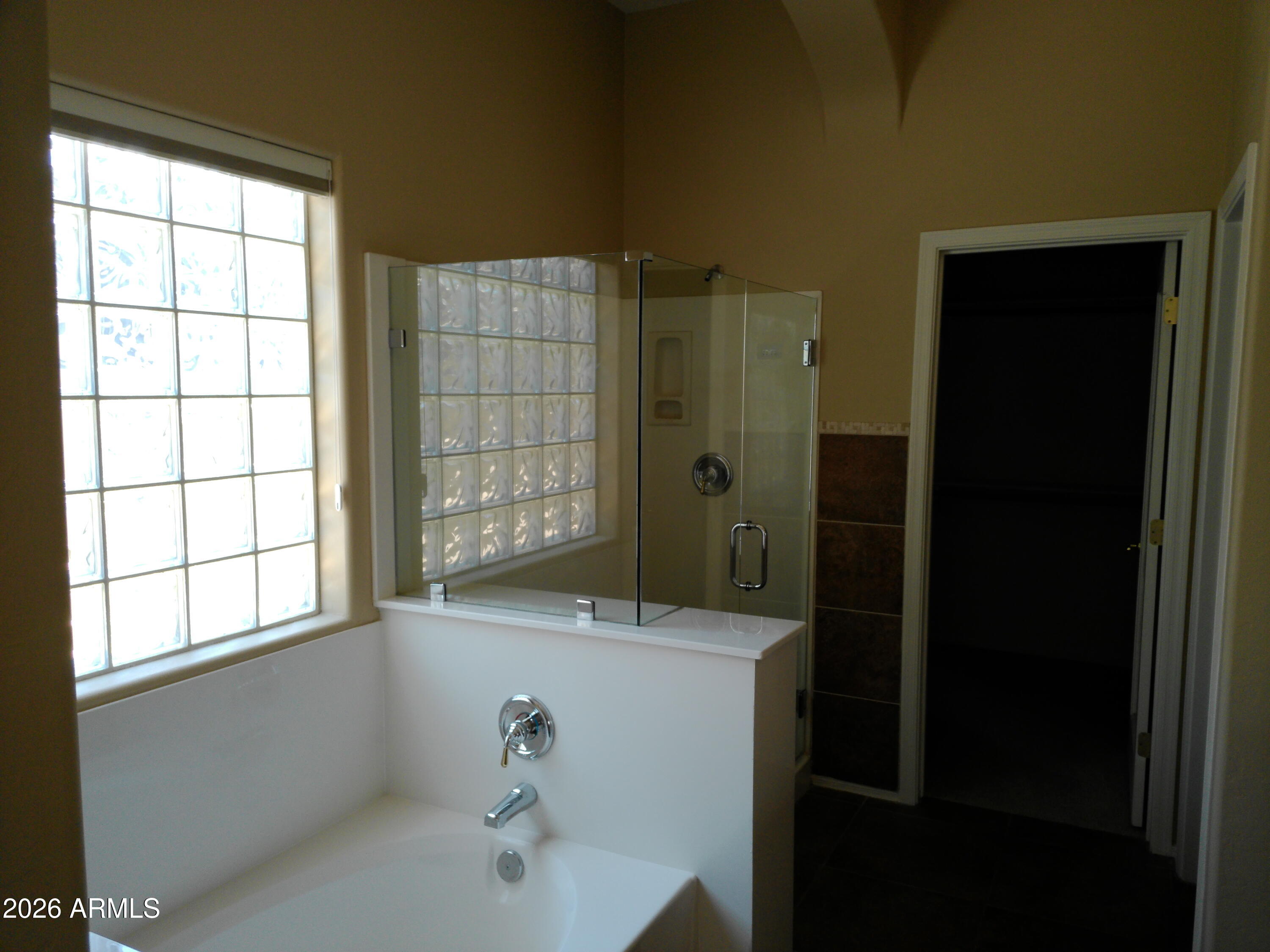 3018 West Sentinel Rock Road Phoenix, AZ 85086 - Photo 15 of 16 a bathroom with a bathtub and shower
