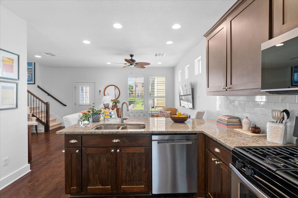 12200 Tawny Farms Road, Unit 139 Austin, TX 78748 - Photo 4 of 30 Step inside, and you’re instantly greeted by this fantastic open-concept layout. Standing at the kitchen island, you have a completely unobstructed view right into the main living room, making this the absolute perfect setup for entertaining.