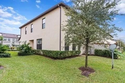 a kitchen with stainless steel appliances granite countertop a stove top oven a sink a dining table and chairs