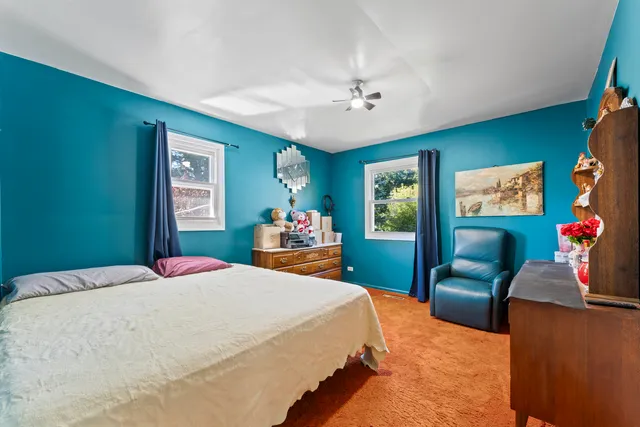 a bedroom with a bed and furniture