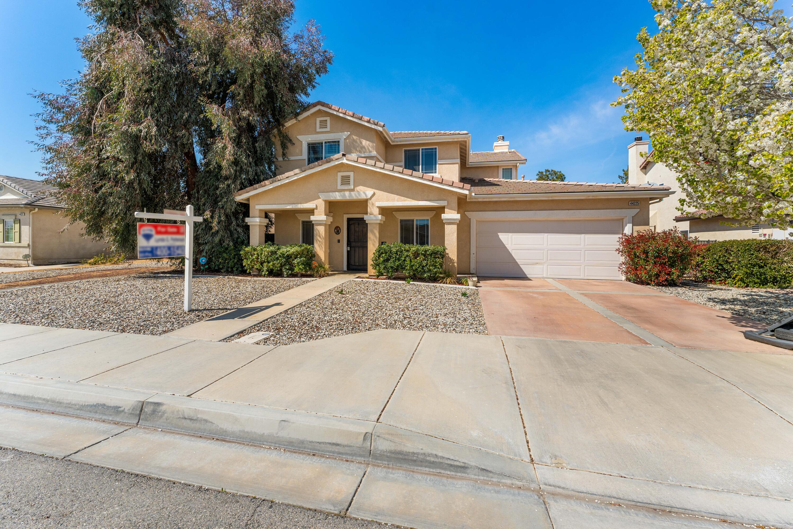 a front view of a house with yard