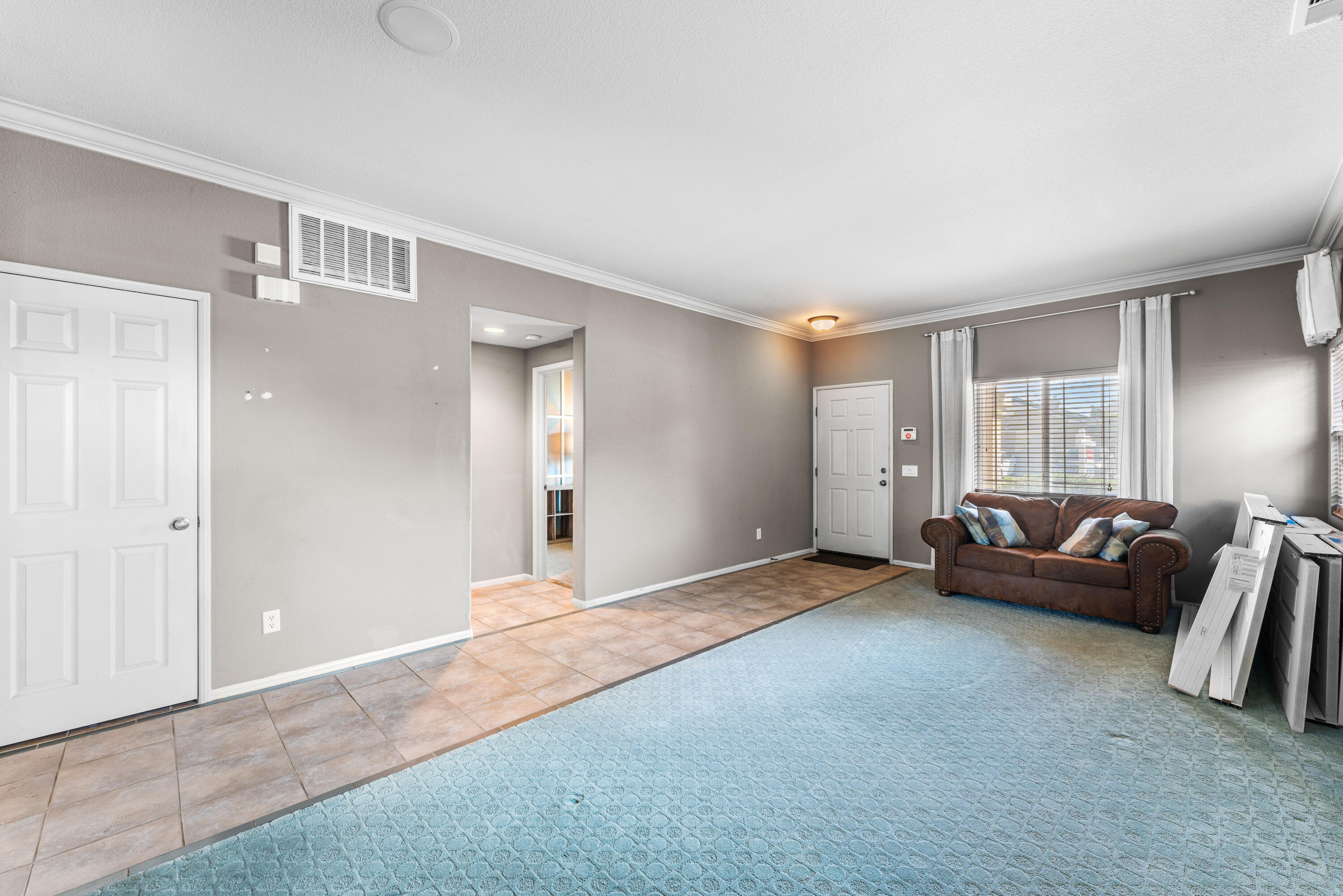 44225 Rucker Street Lancaster, CA 93535 - Photo 12 of 16 a living room with furniture and a window