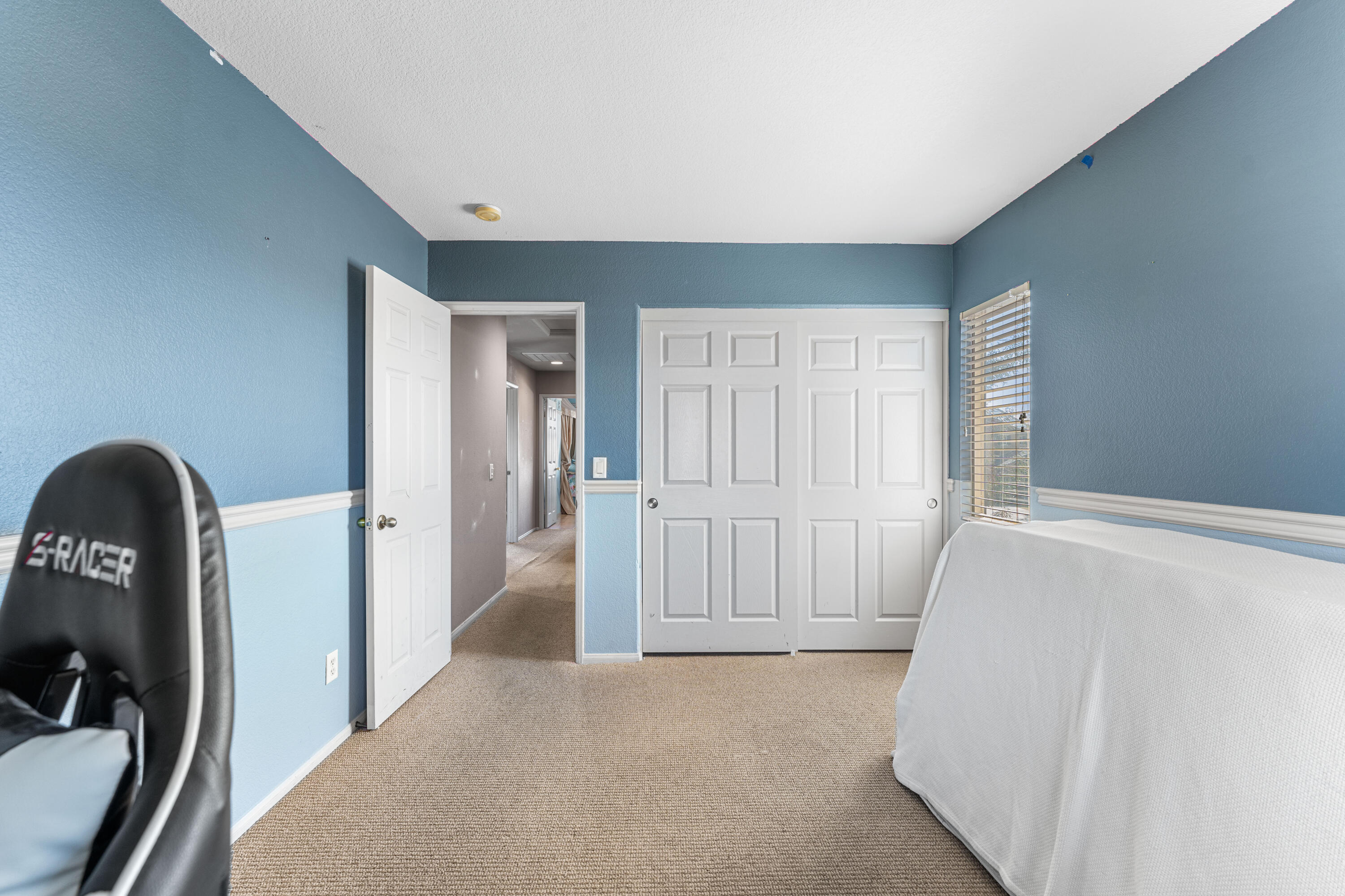 44225 Rucker Street Lancaster, CA 93535 - Photo 14 of 16 a view of a livingroom with wooden floor and entryway