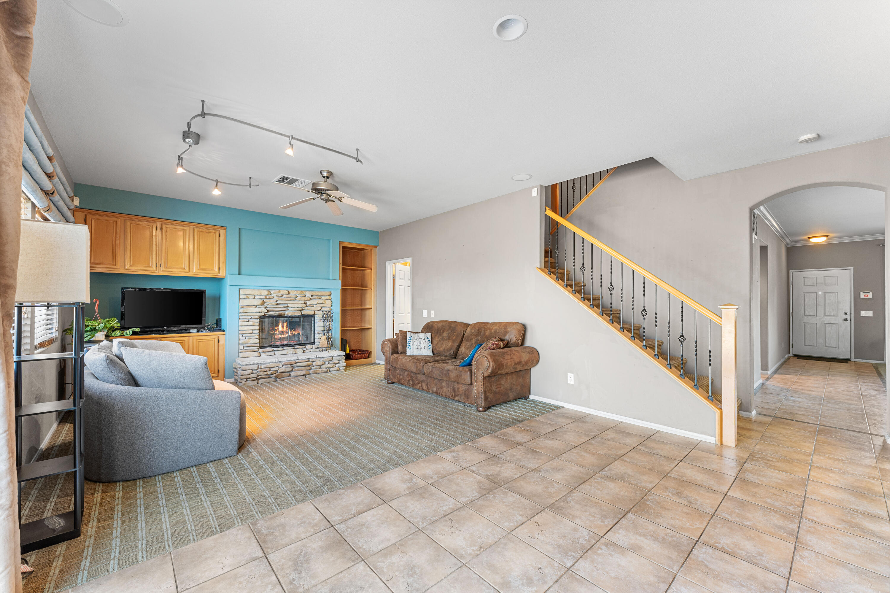 44225 Rucker Street Lancaster, CA 93535 - Photo 7 of 16 a living room with furniture and a flat screen tv