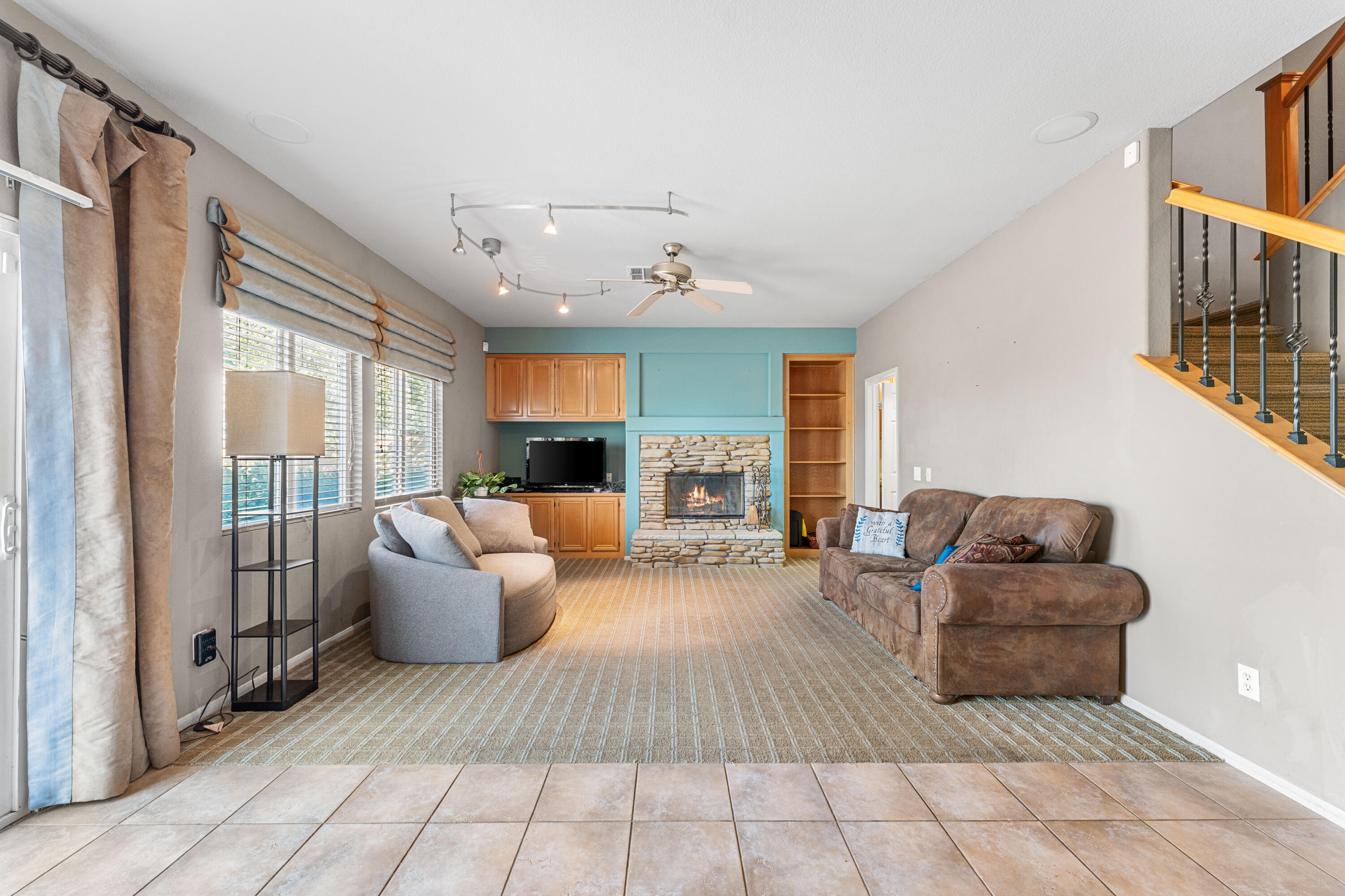 44225 Rucker Street Lancaster, CA 93535 - Photo 8 of 16 a living room with furniture and a large window