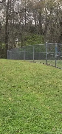 a view of a field with a big yard