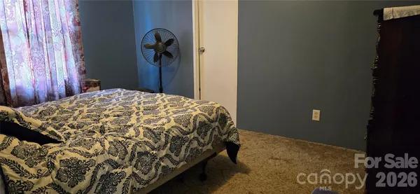 a bedroom with a bed and a closet