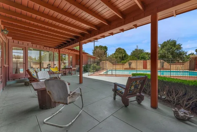 a view of a garden with a building in the background