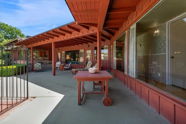 a kitchen with a sink and white cabinets