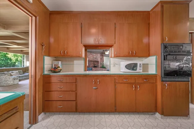 a kitchen with a sink and a refrigerator