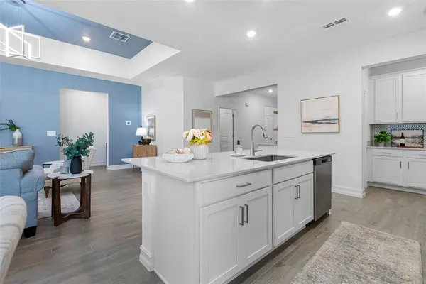 a kitchen with a cabinets and a stove top oven