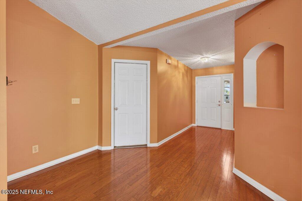 2472 Moon Harbor Way Middleburg, FL 32068 - Photo 12 of 52 a view of empty room with wooden floor