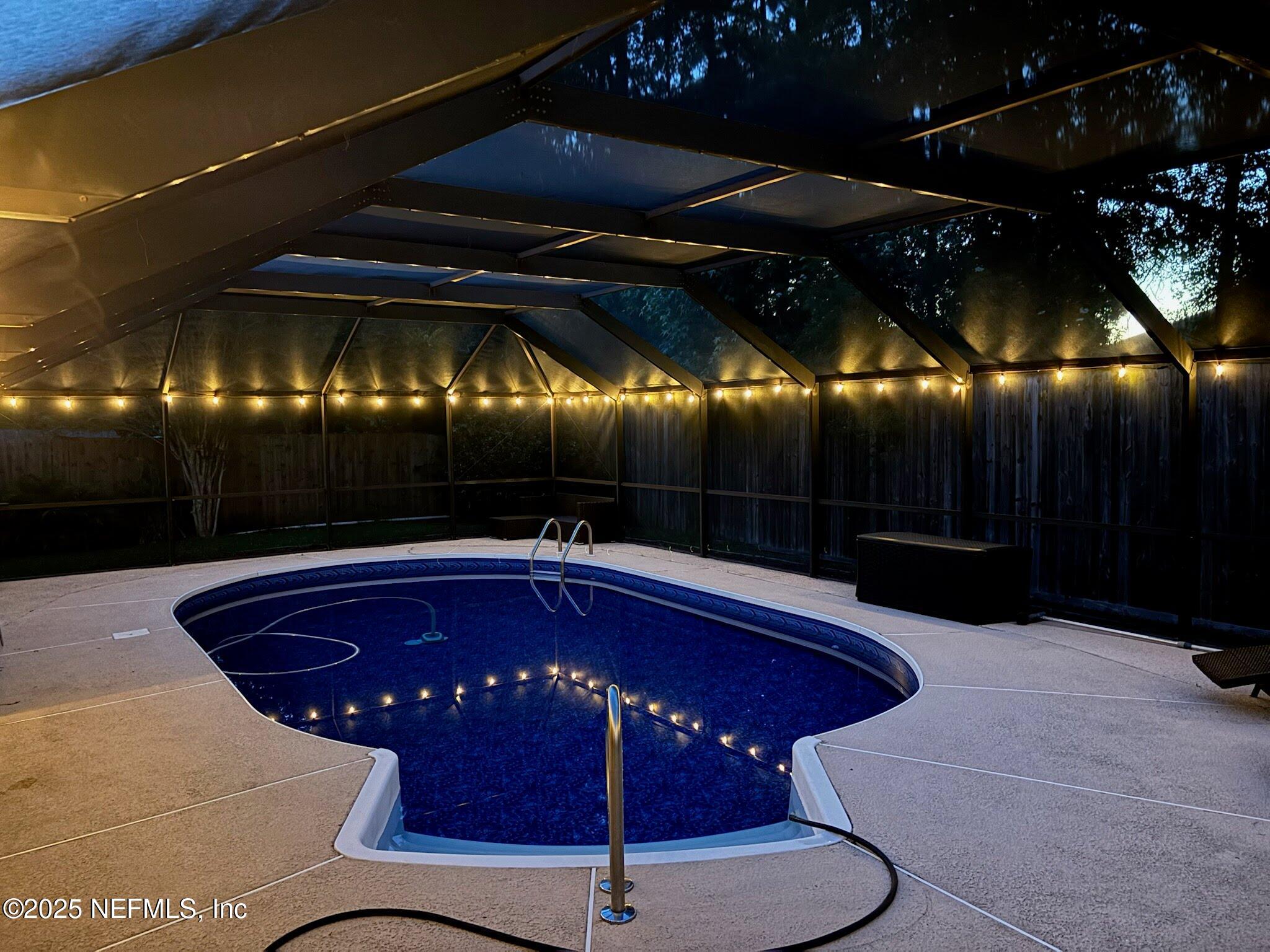 2472 Moon Harbor Way Middleburg, FL 32068 - Photo 9 of 52 a view of a chairs and table in the patio