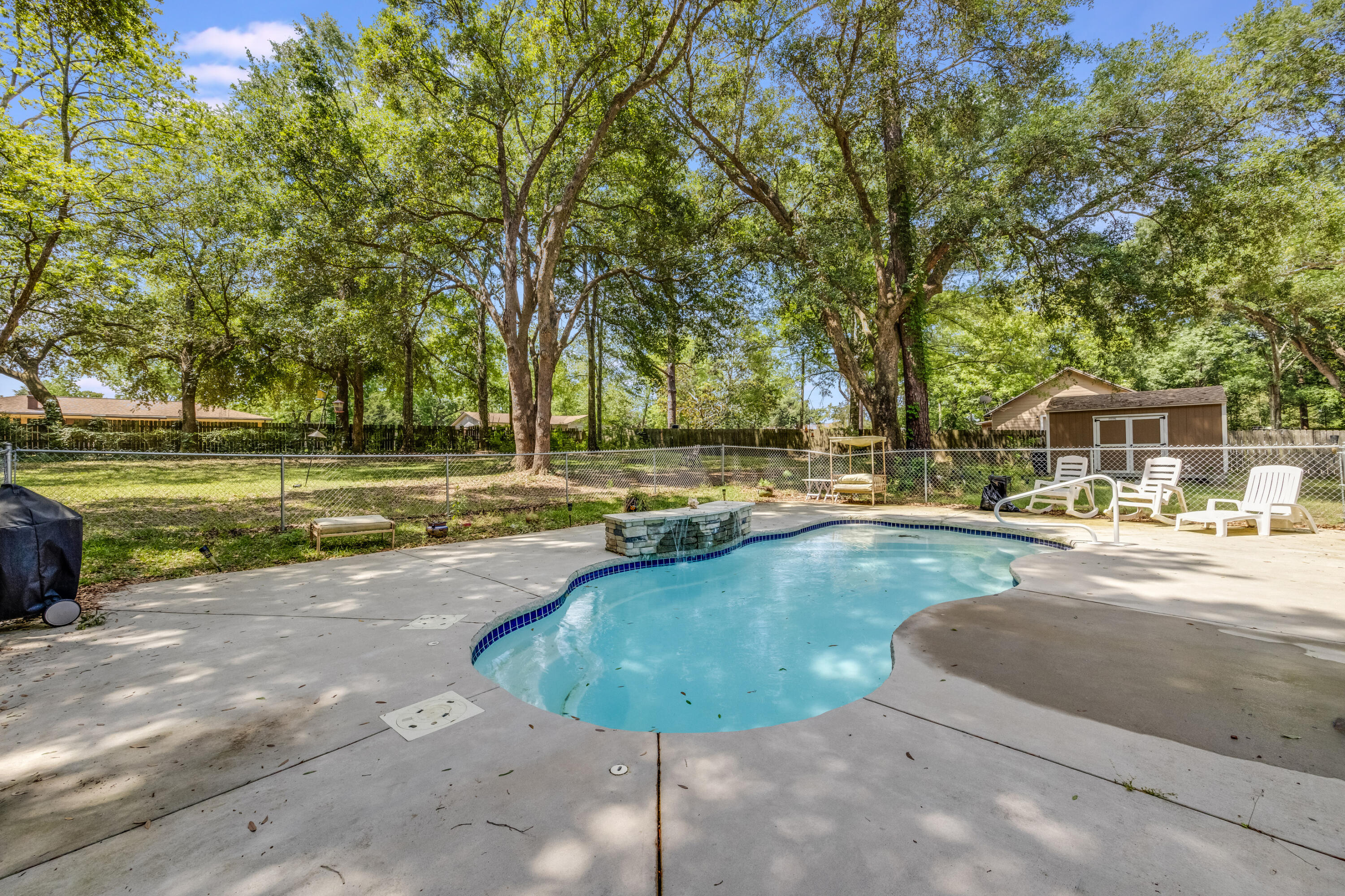 6633 Frank Reeder Road Pensacola, FL 32526 - Photo 15 of 43 a view of a swimming pool with a patio