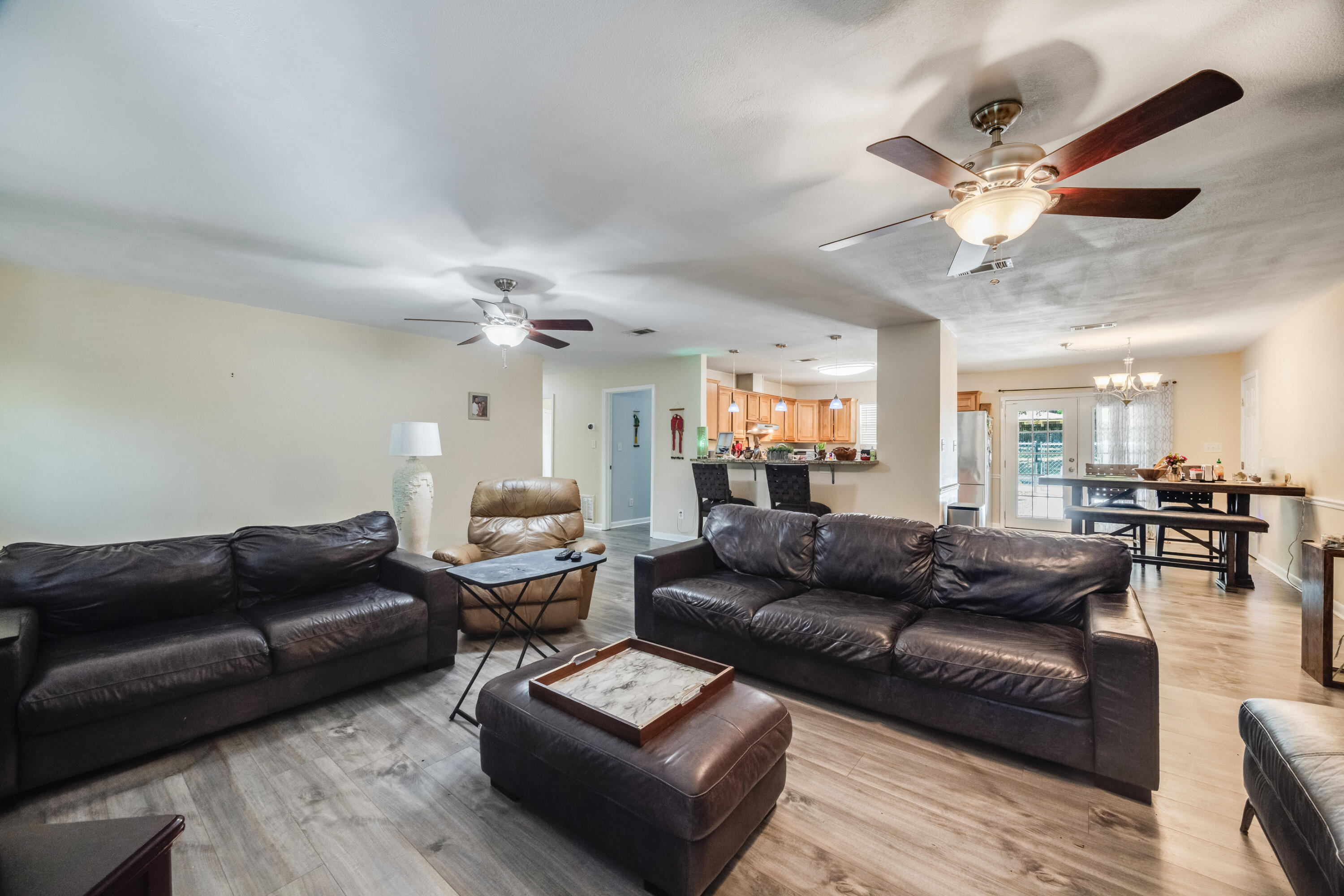 6633 Frank Reeder Road Pensacola, FL 32526 - Photo 23 of 43 a living room with furniture and a ceiling fan