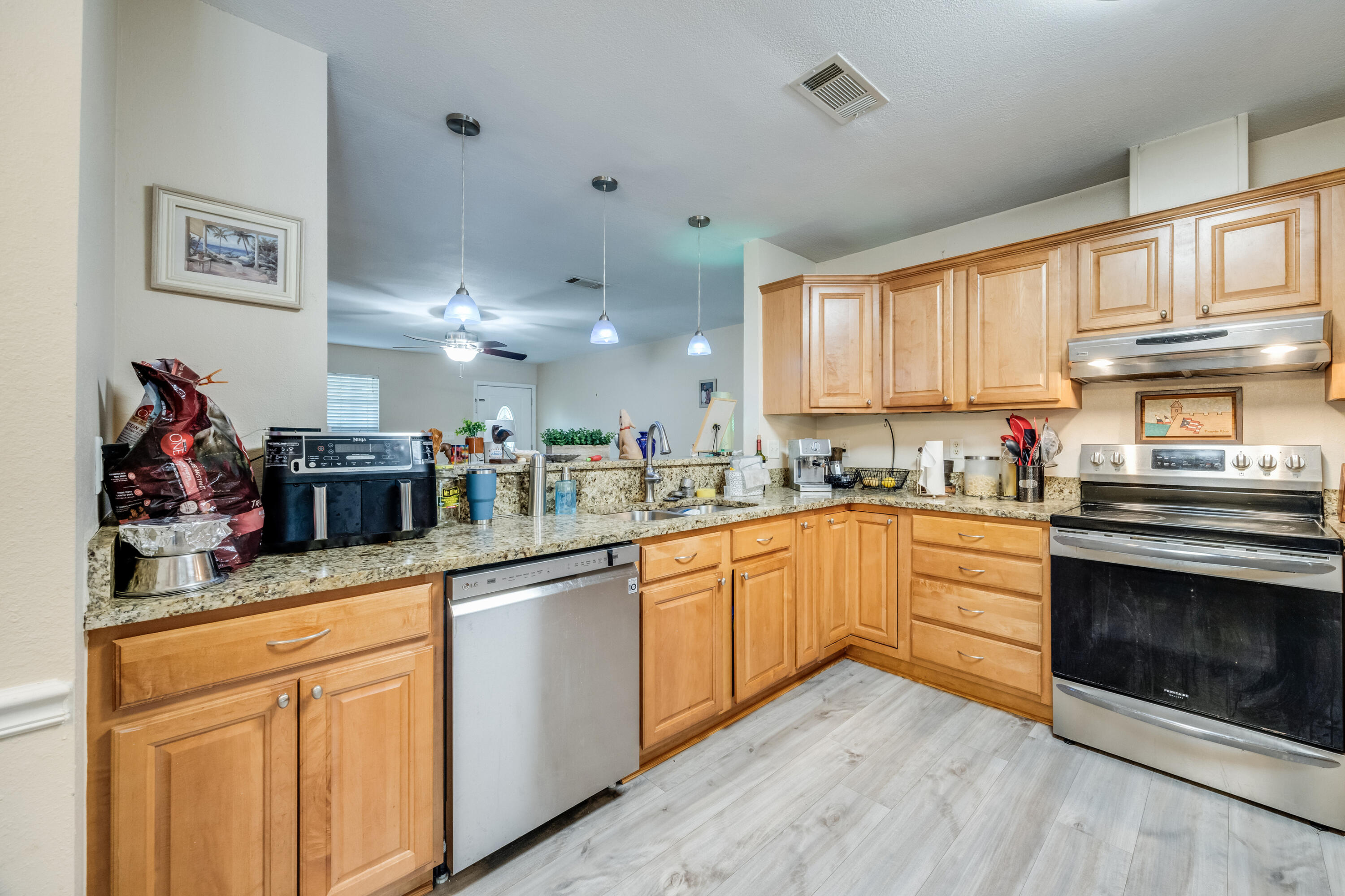 6633 Frank Reeder Road Pensacola, FL 32526 - Photo 29 of 43 a kitchen with stainless steel appliances granite countertop a stove and cabinets