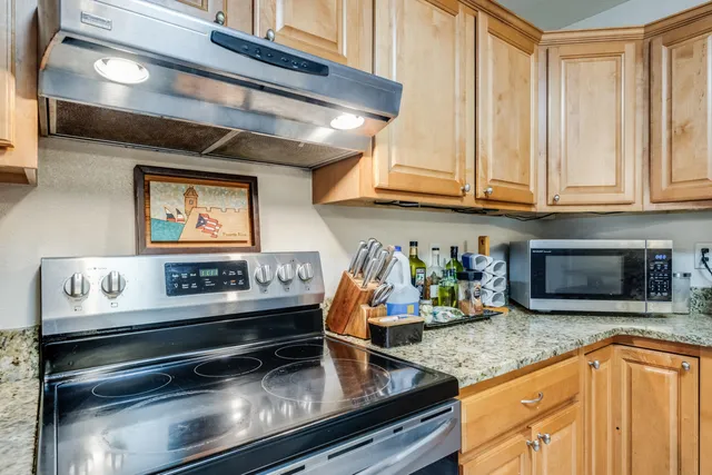 a kitchen with a table and chairs in it