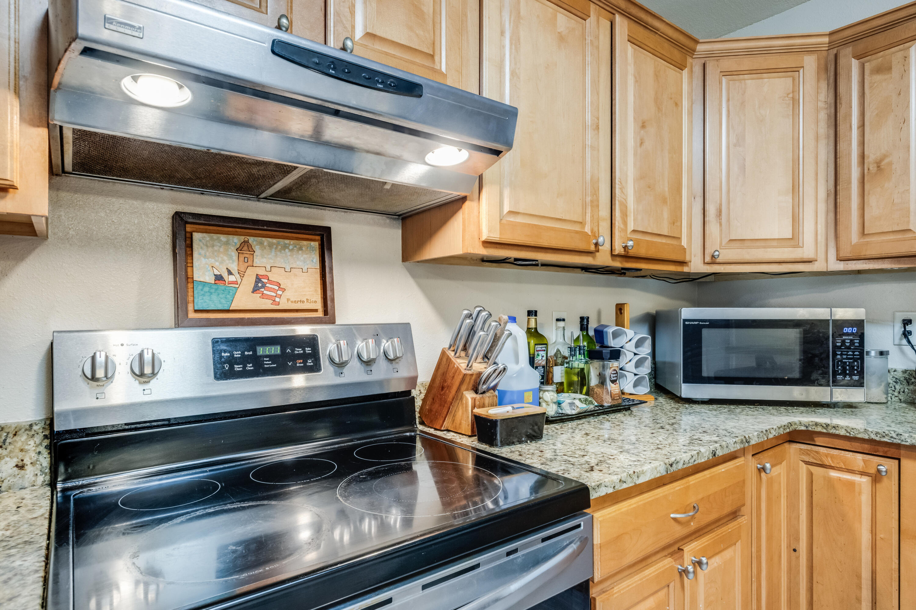 6633 Frank Reeder Road Pensacola, FL 32526 - Photo 32 of 43 a kitchen with stainless steel appliances granite countertop a sink and cabinets