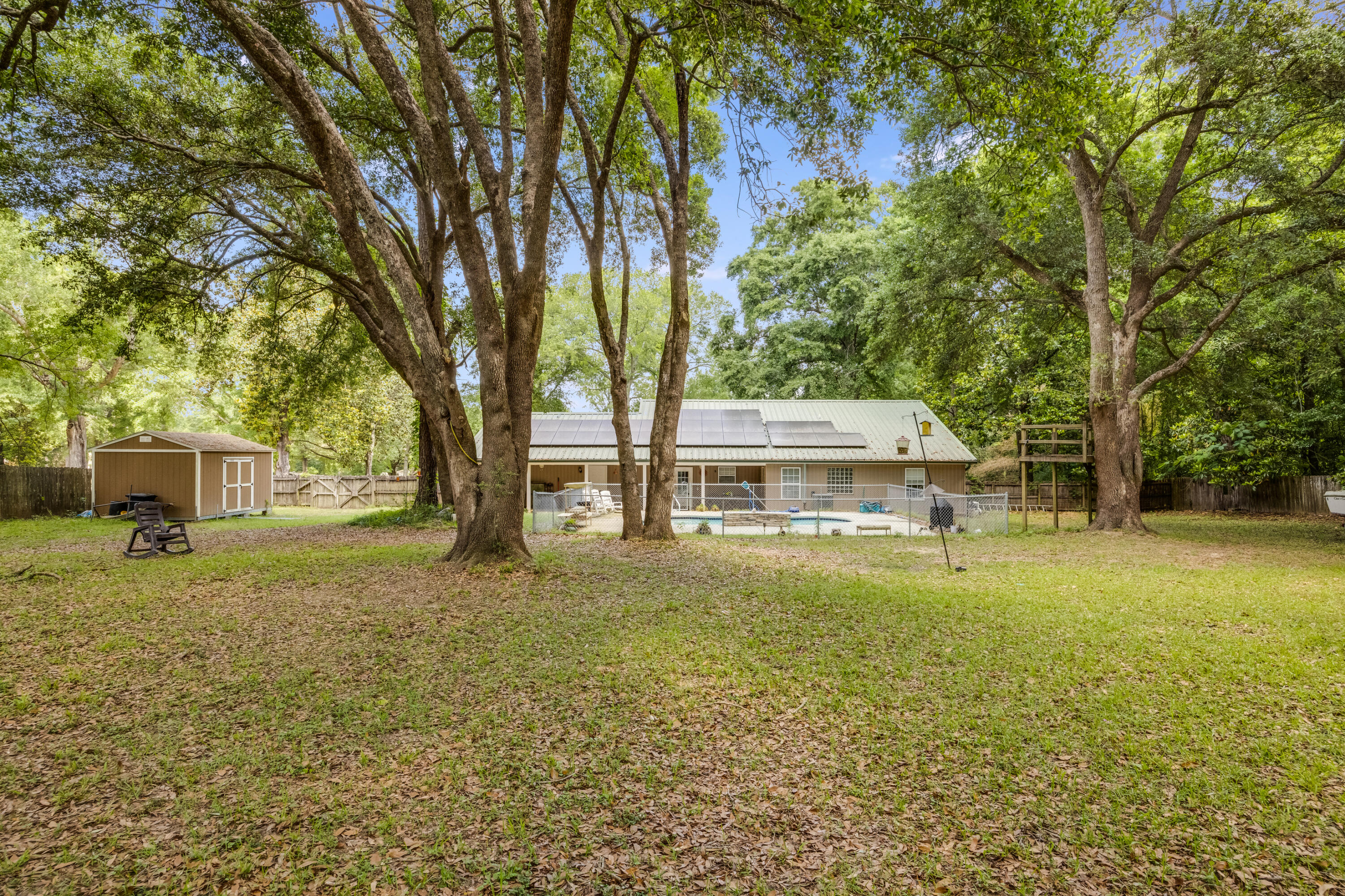 6633 Frank Reeder Road Pensacola, FL 32526 - Photo 9 of 43 a view of a house with a yard