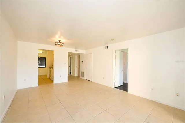 a kitchen with sink and cabinets