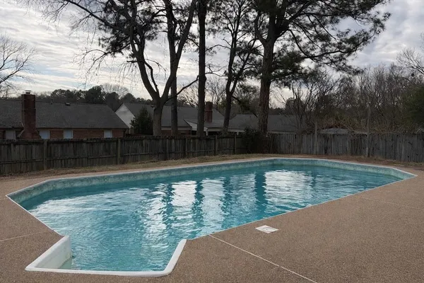 a bathroom with a sink a toilet a mirror and bathtub