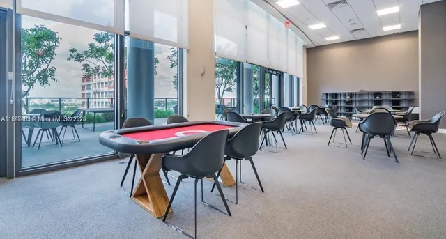 a view of a patio with table and chairs