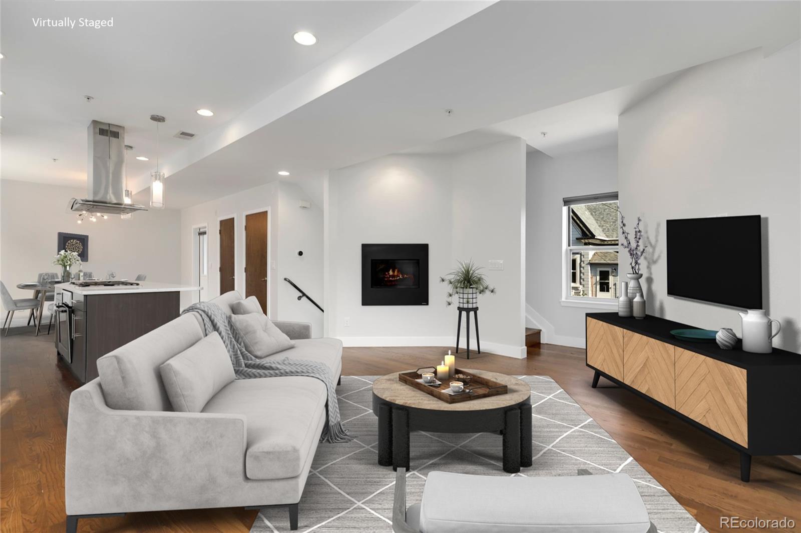 3336 Tejon Street, Unit 4 Denver, CO 80211 - Photo 1 of 35 a living room with furniture and a flat screen tv