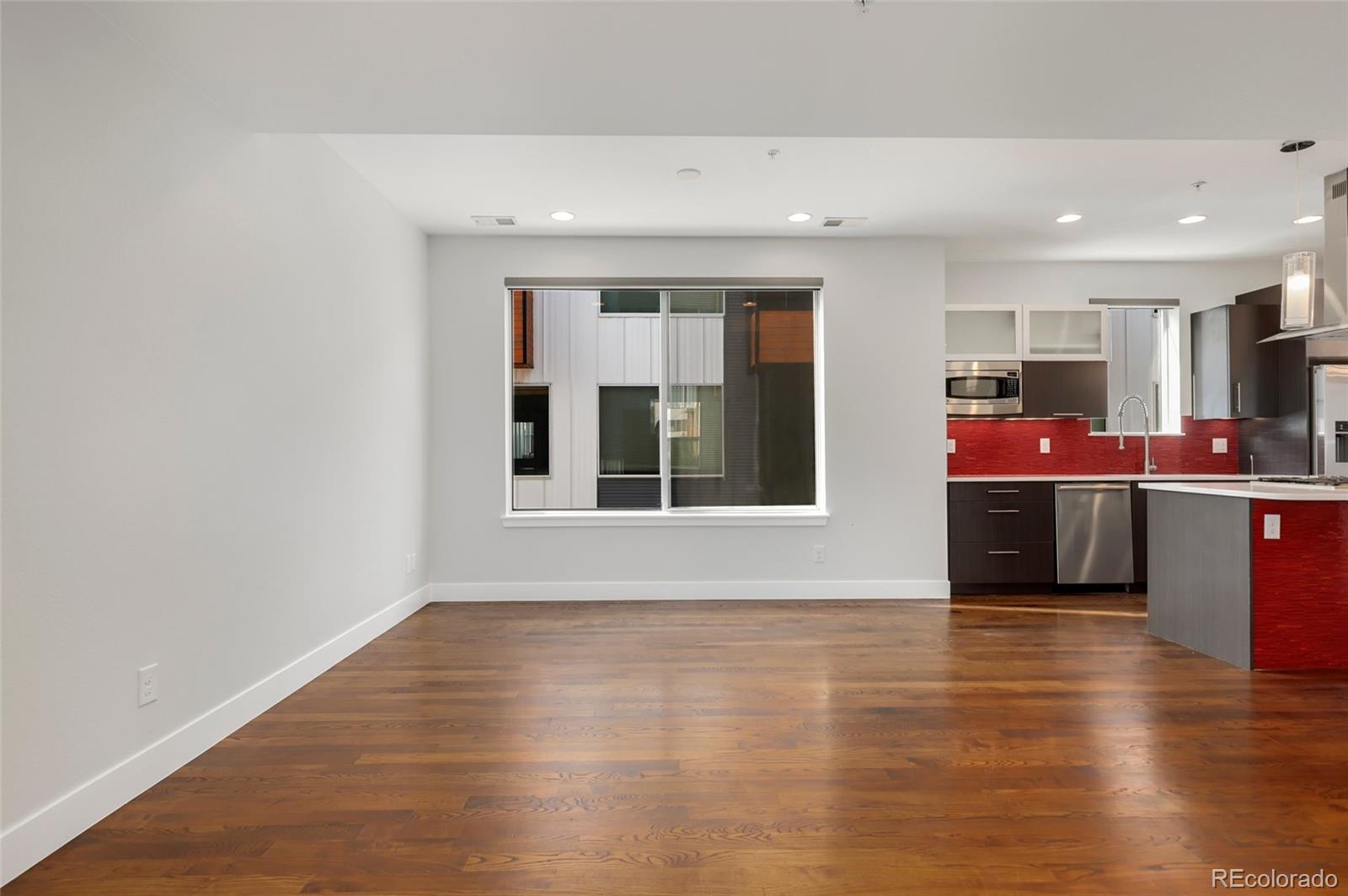 3336 Tejon Street, Unit 4 Denver, CO 80211 - Photo 11 of 35 a view of kitchen with furniture and wooden floor