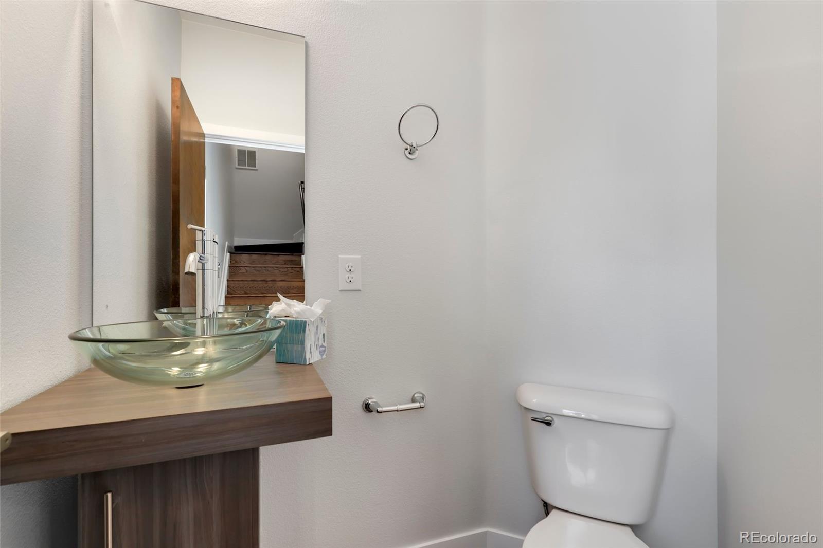3336 Tejon Street, Unit 4 Denver, CO 80211 - Photo 14 of 35 a bathroom with a sink a toilet and mirror