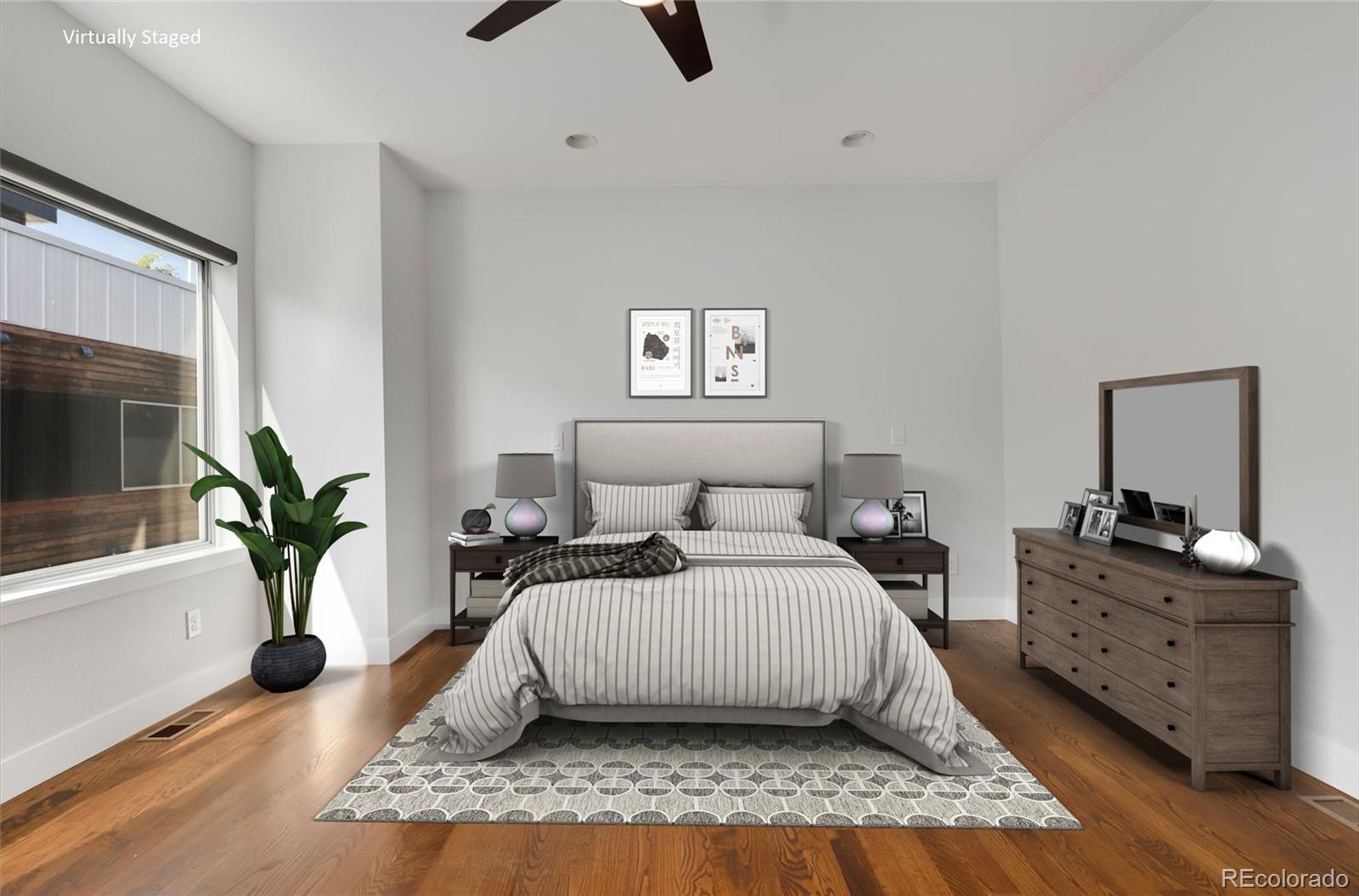 3336 Tejon Street, Unit 4 Denver, CO 80211 - Photo 2 of 35 a bedroom with a bed and wooden floor