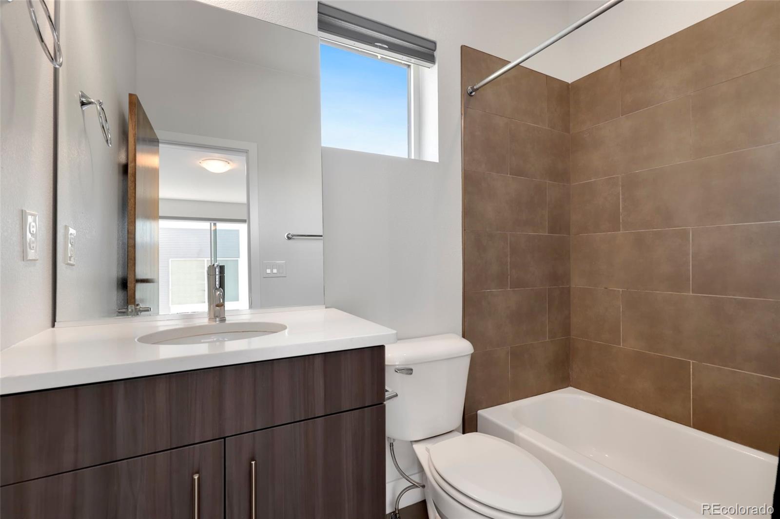 3336 Tejon Street, Unit 4 Denver, CO 80211 - Photo 21 of 35 a bathroom with a sink a toilet and shower