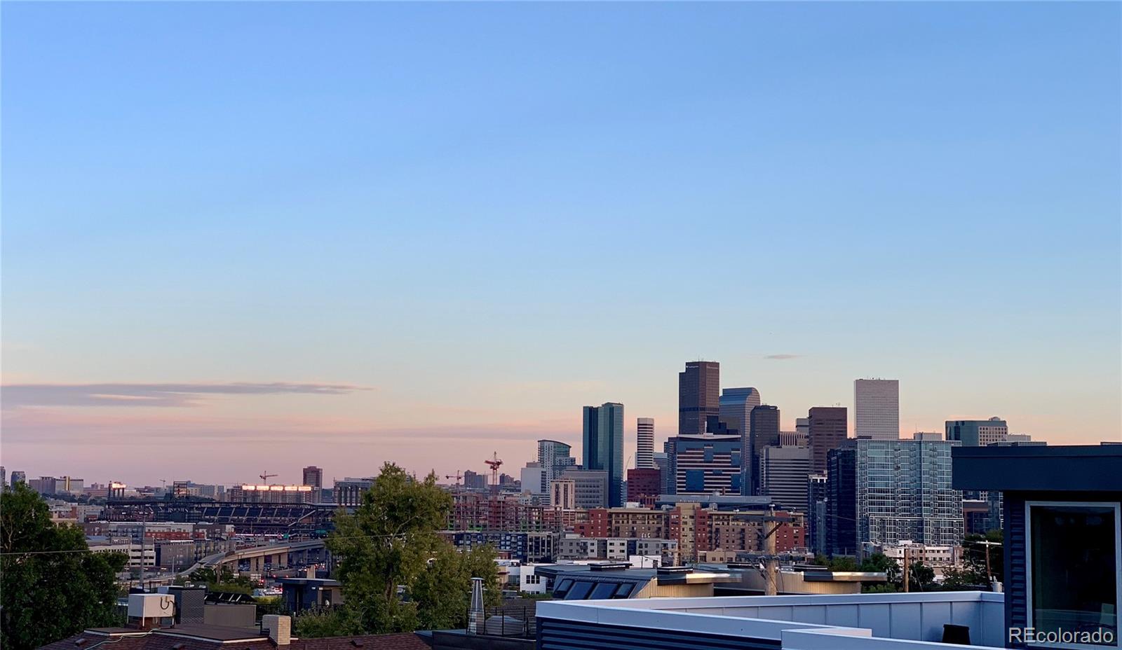 3336 Tejon Street, Unit 4 Denver, CO 80211 - Photo 29 of 35 a view of a city with tall buildings in the background