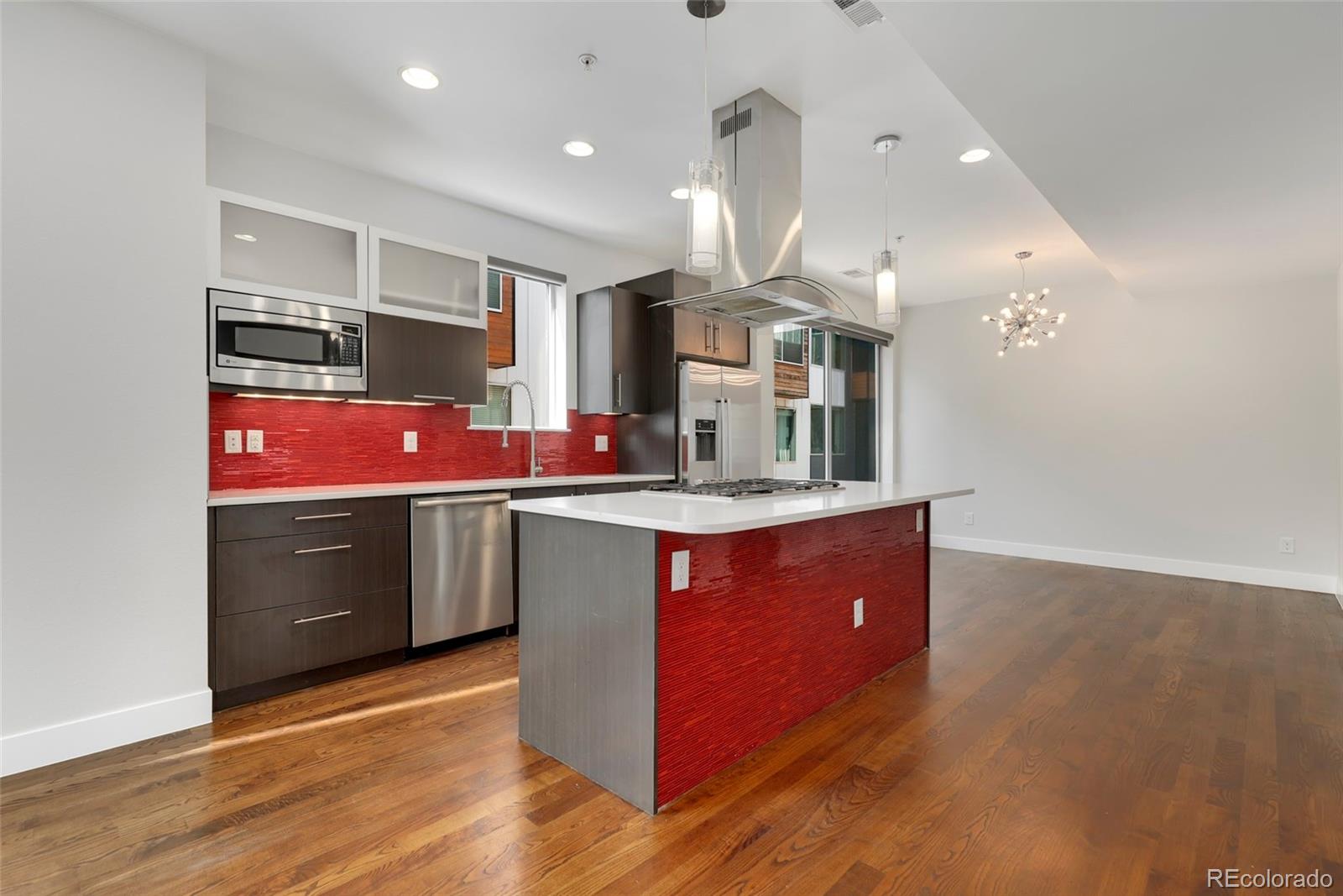 3336 Tejon Street, Unit 4 Denver, CO 80211 - Photo 5 of 35 a kitchen with granite countertop a sink and cabinets