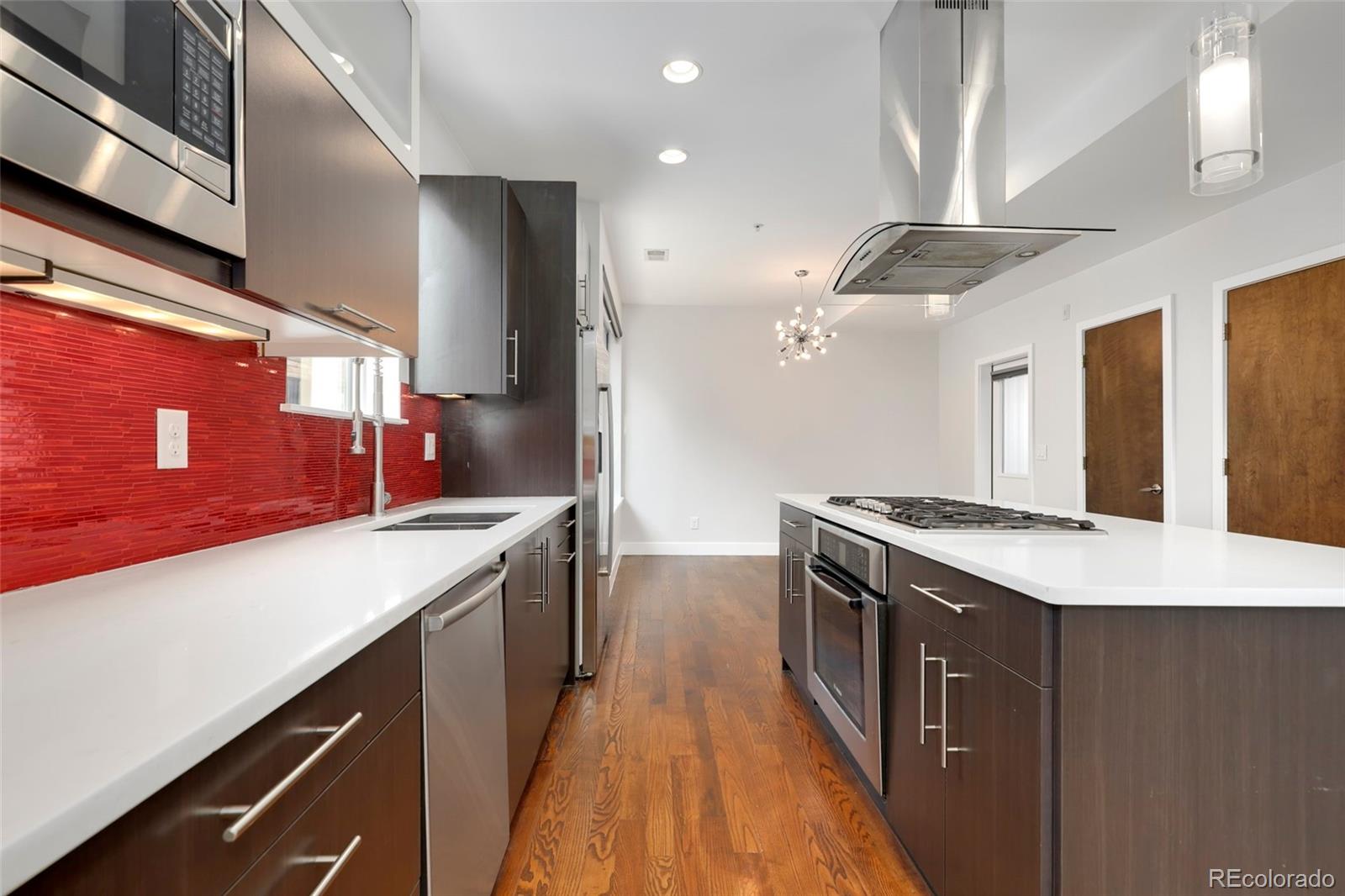 3336 Tejon Street, Unit 4 Denver, CO 80211 - Photo 7 of 35 a kitchen with a stove and a sink