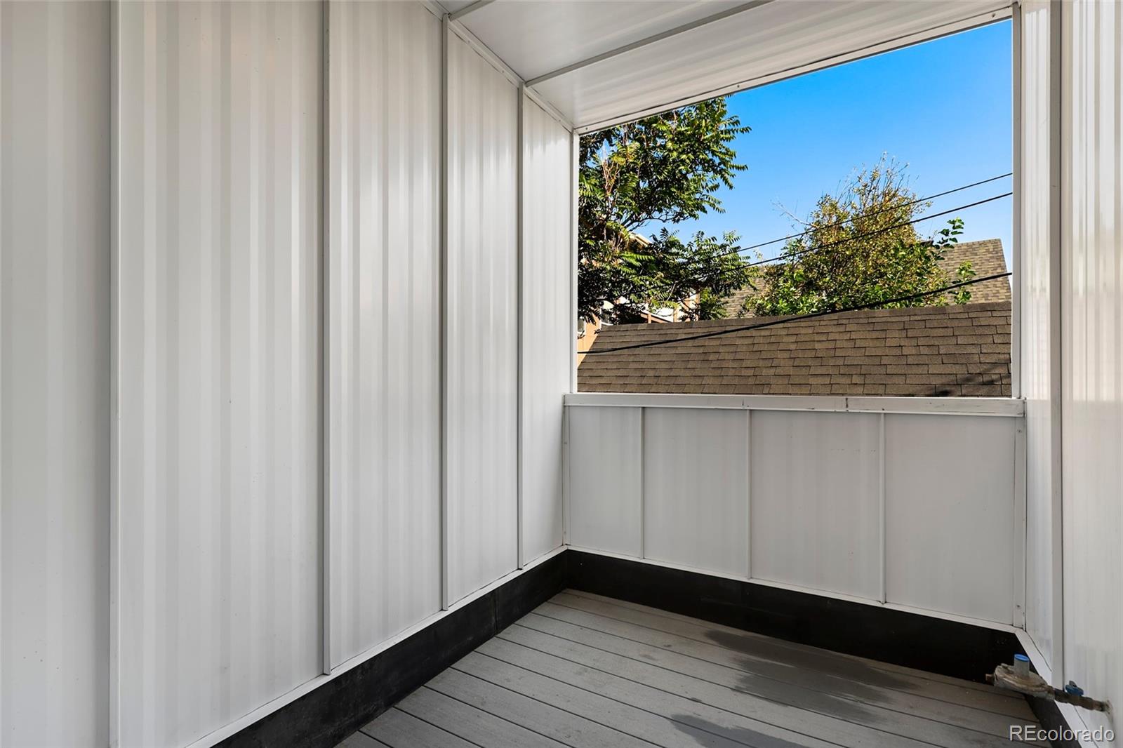 3336 Tejon Street, Unit 4 Denver, CO 80211 - Photo 10 of 35 a view of a floor to ceiling window and wooden floor