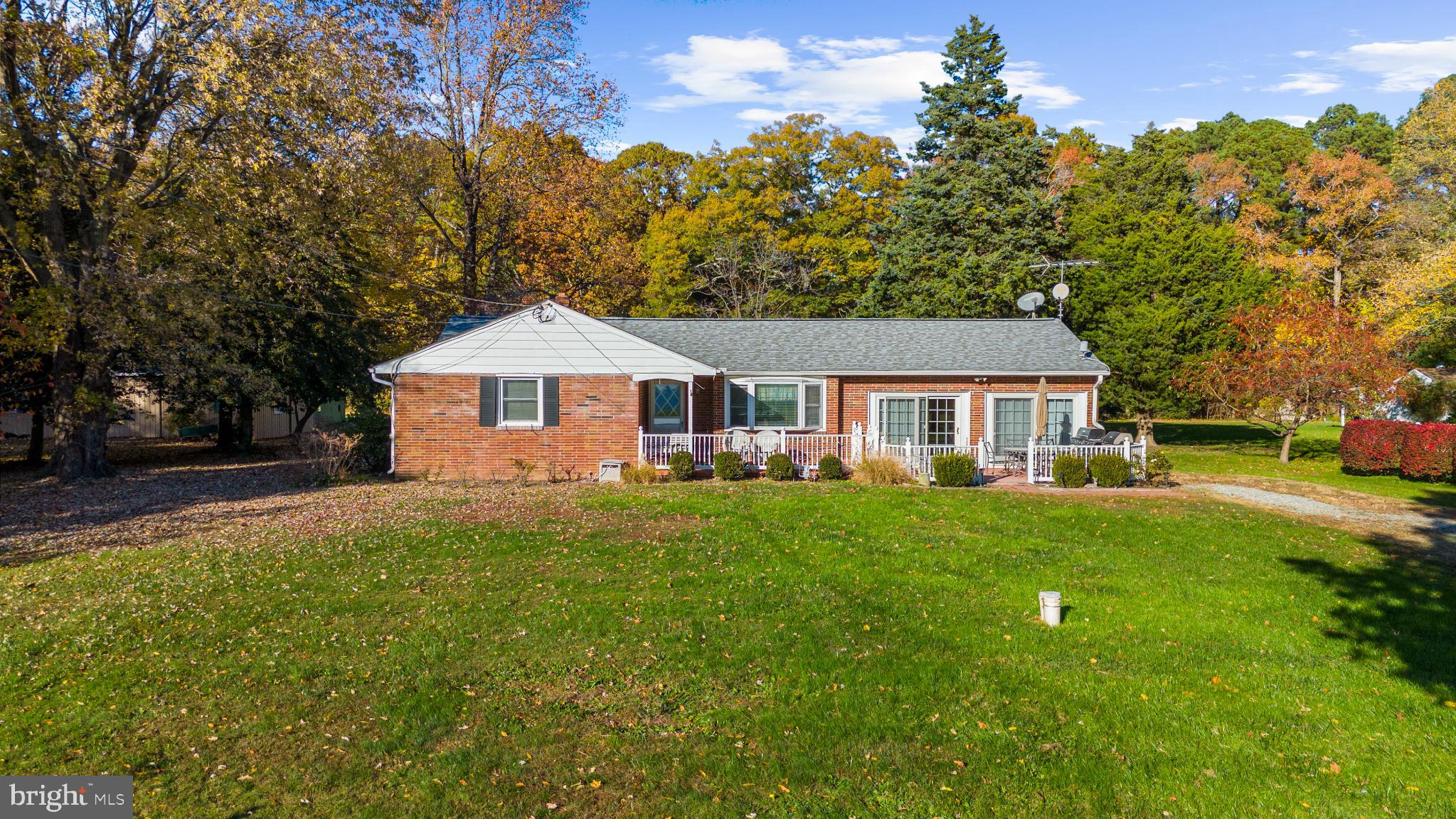 4671 Cliffs City Road Chestertown, MD 21620 - Photo 3 of 47 Charming brick home amid vibrant autumn hues.