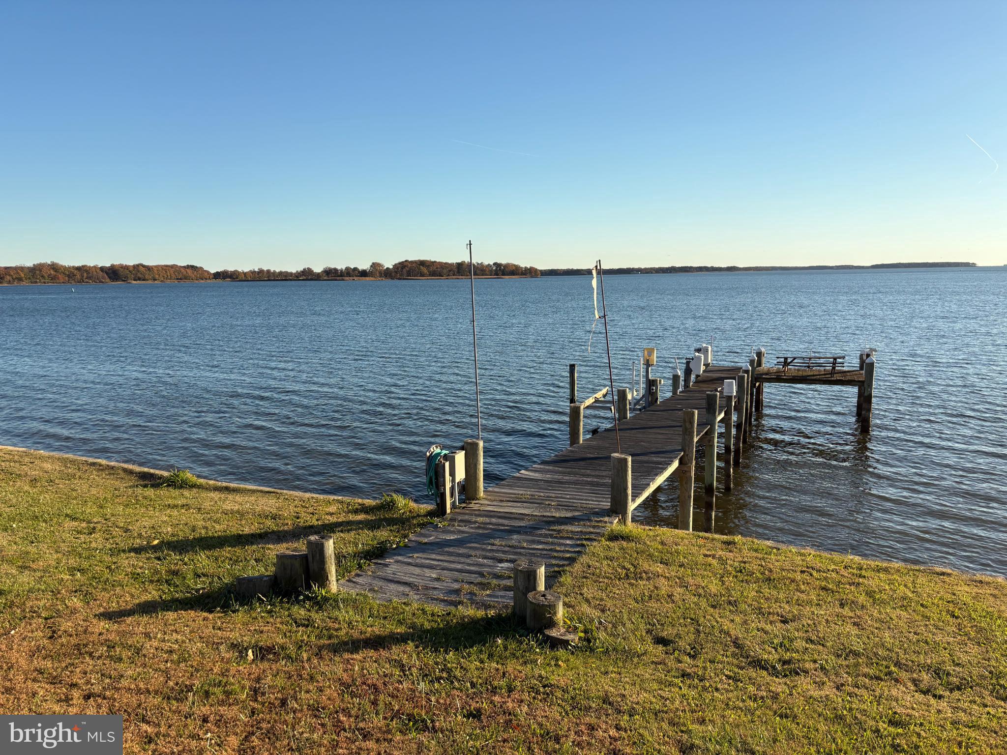 4671 Cliffs City Road Chestertown, MD 21620 - Photo 8 of 47 Tranquil dock by serene waterscape.
